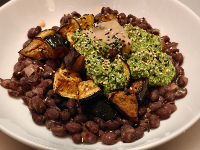 Charred Aubergine and Courgette with Coriander Cashew Chimichurri over Black Beans